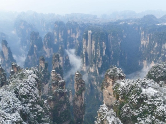 Rime covered rock pillars stretch up to sky in land of 'Avatar'